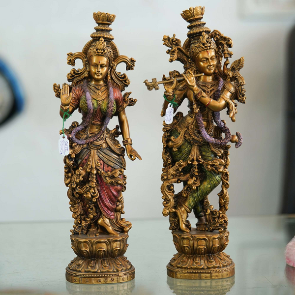 Pair of Brass Statues: Man Playing Flute and Woman Holding Flower